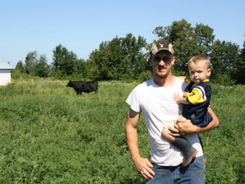 justin with son and cow-cropped